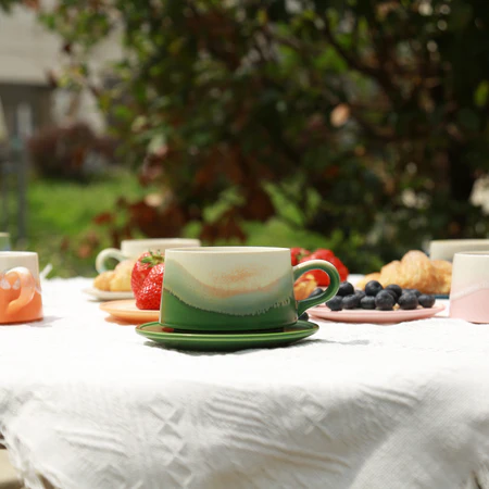 Handcrafted ceramic mug in warm morning light